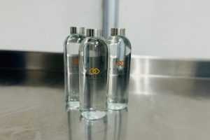 refillable glass bottles on a table