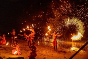 Fire dancers performing a fire dance at Sofitel Fiji Resort & Spa