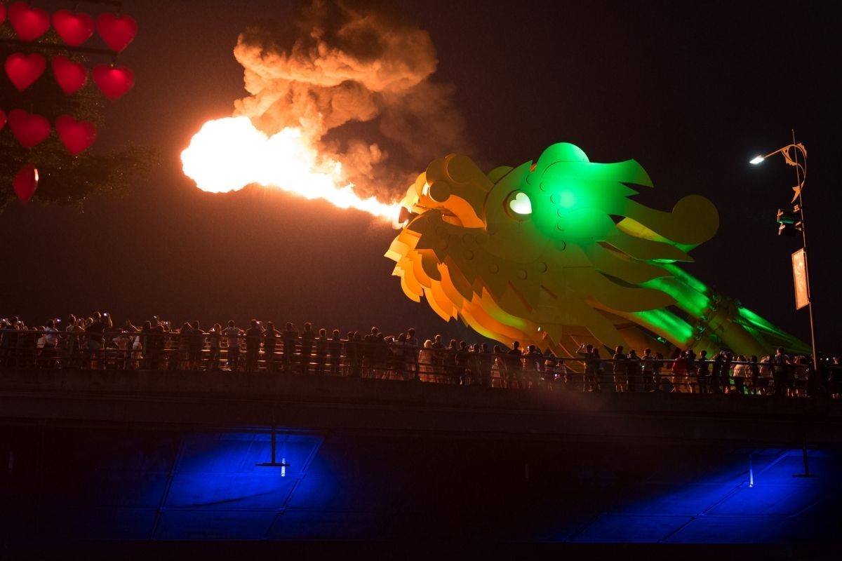 night scene of the dragon bridge breathing bright fire