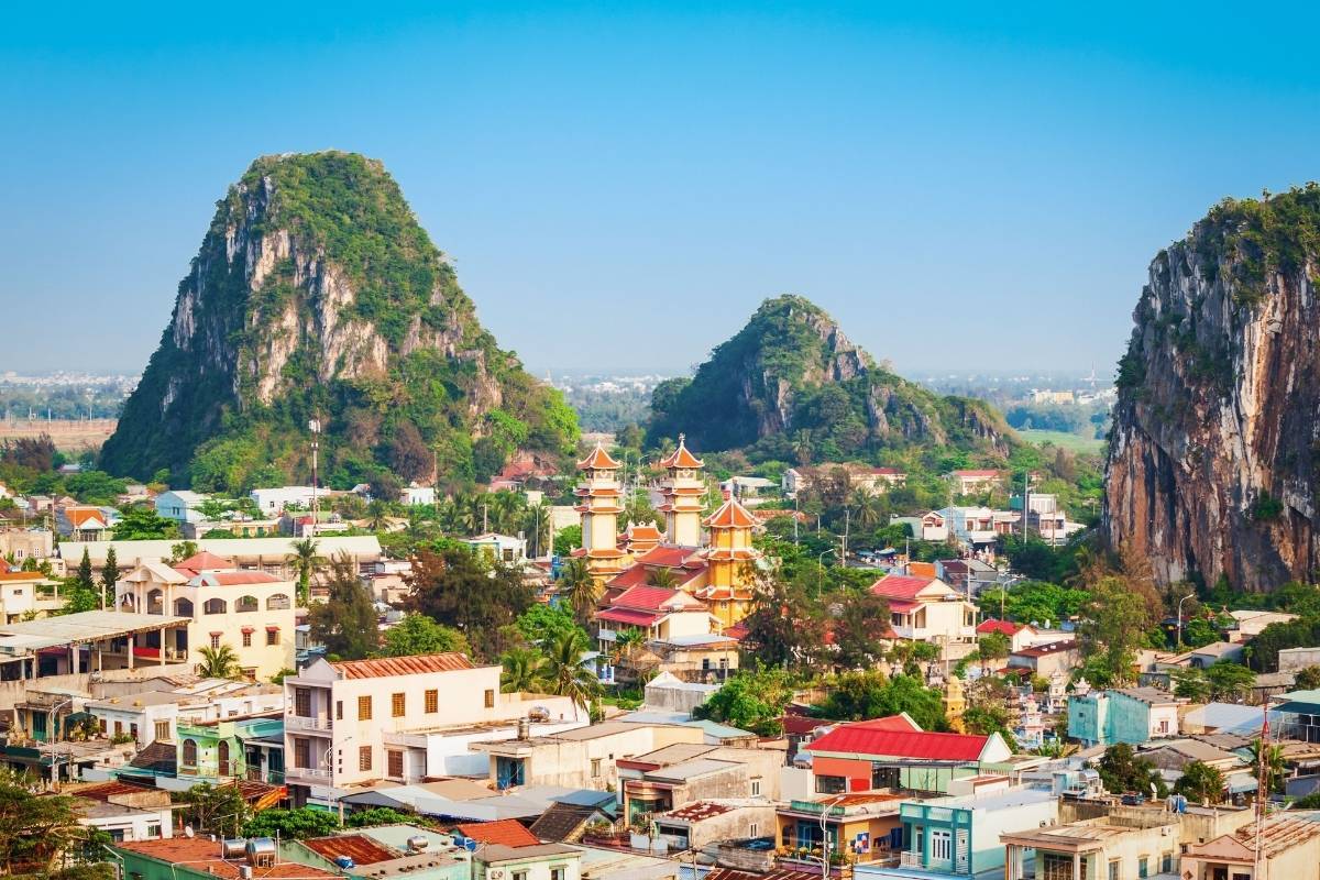 city view with marble mountain peaks in the distance