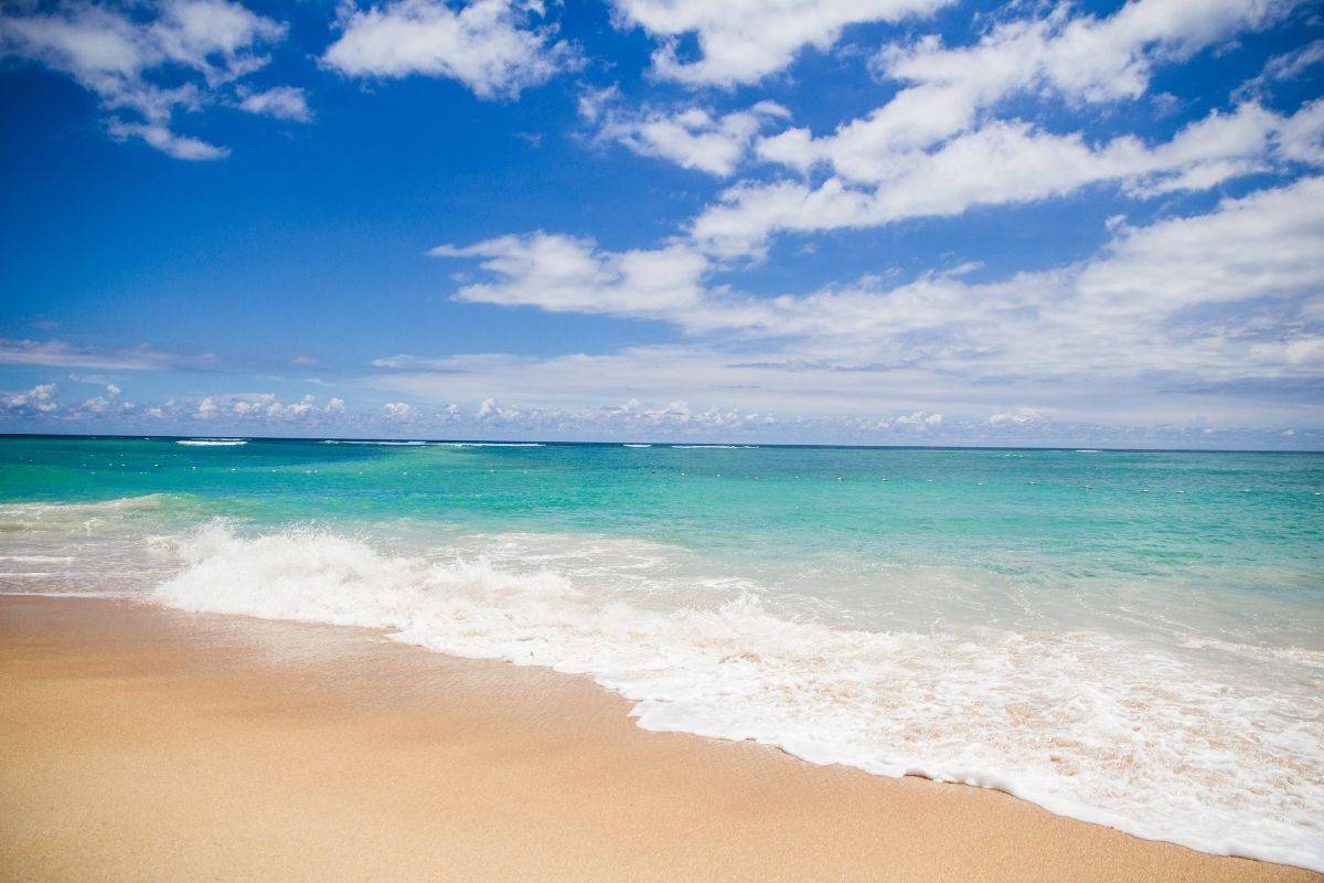Gentle waves washing onto the golden sand at Non Nuoc Beach