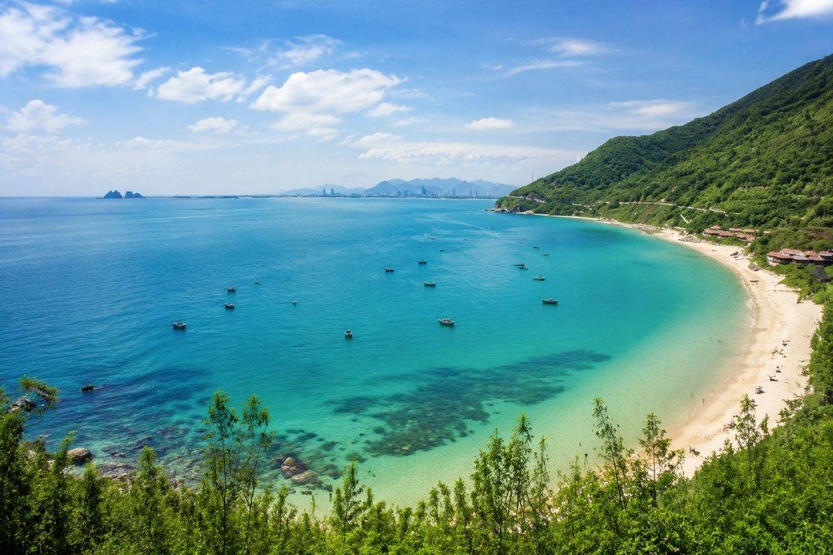Panoramic view of Tien Sa Beach with turquoise water and surrounding mountains