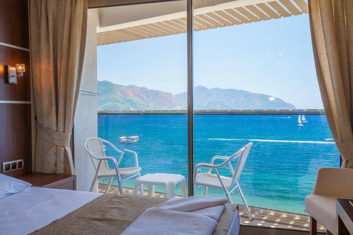 Premium room interior at Pullman Danang Beach Resort with a sea-facing balcony and turquoise ocean view