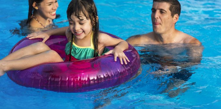 family-enjoying-nice-day-pool