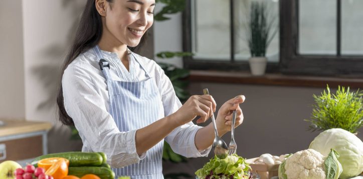 happy-woman-preparing-healthy-salad-kitchen-1