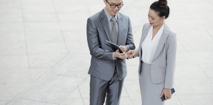 entrepreneurs-checking-data-tablet