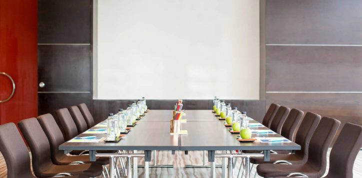 empty-meeting-room-with-table-whiteboard-1-1