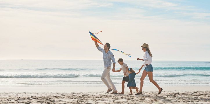 family-holding-hands-kite-beach-together-holiday-travel-vacation-summer-energy-love-running-with-mom-dad-children-sand-coast-by-ocean-sea-bonding-freedom