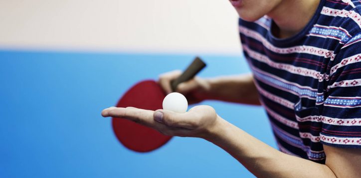 asian-guy-playing-table-tennis