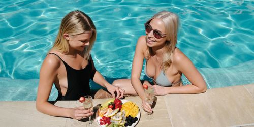 hotel guests enjoying the pool at sofitel noosa pacific resort