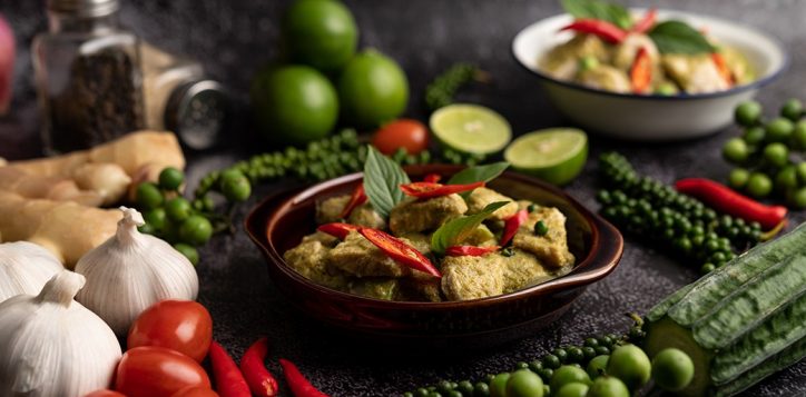 pork-green-curry-brown-bowl-with-spices-black-cement-background.jpg