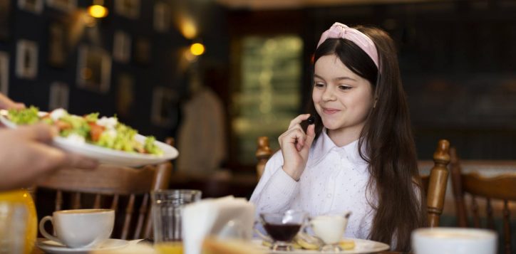 close-up-smiley-girl-table-2