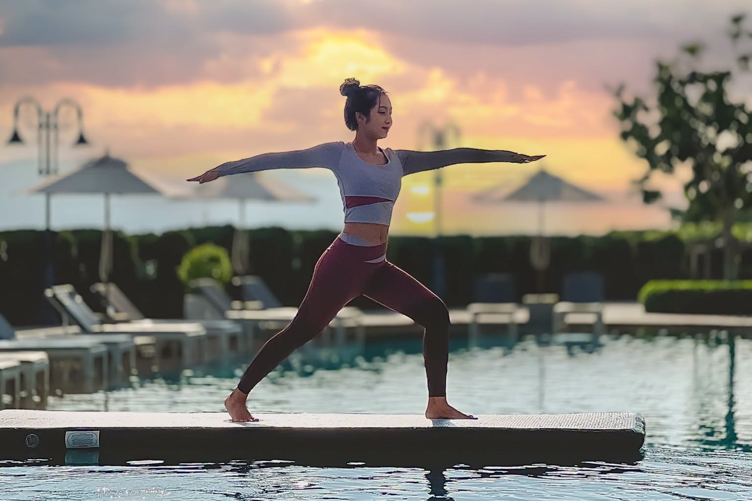 Floating Yoga on the swimming pool at sunset at Mövenpick Resort Khao Yai