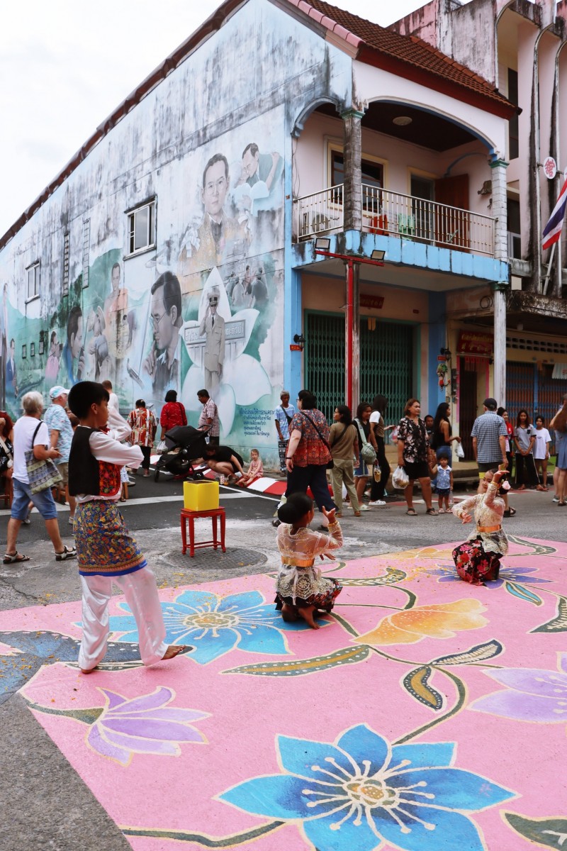 Children dancing at Takua Pa Old Town Walking Street Sunday market in Phang Nga during Green Season