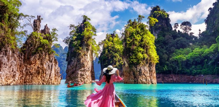 beautiful-girl-standing-boat-looking-mountains-ratchaprapha-dam-khao-sok-national-park-surat-thani-province-thailand-1