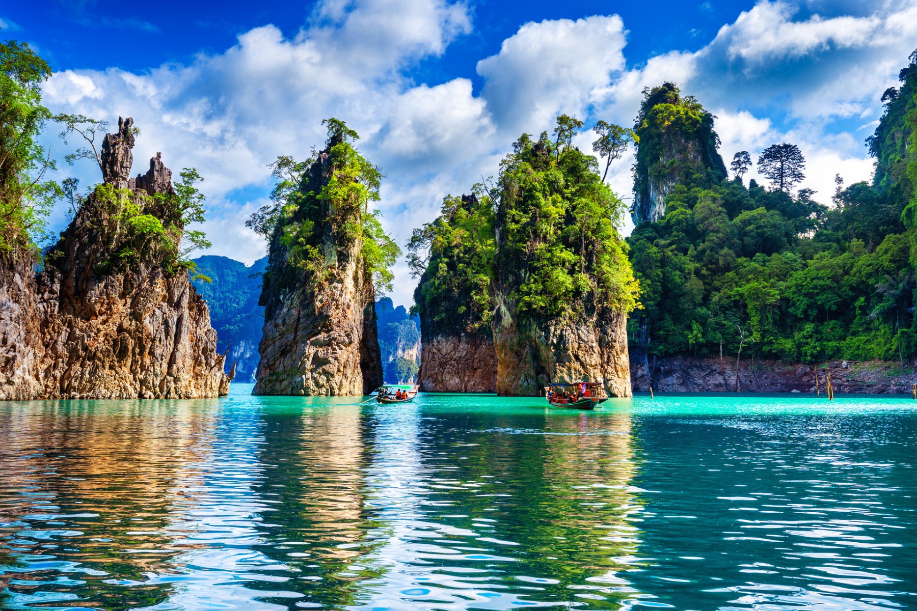 Limestone cliffs at Cheow Lan Lake in Khao Sok during Green Season getaway Khao Lak