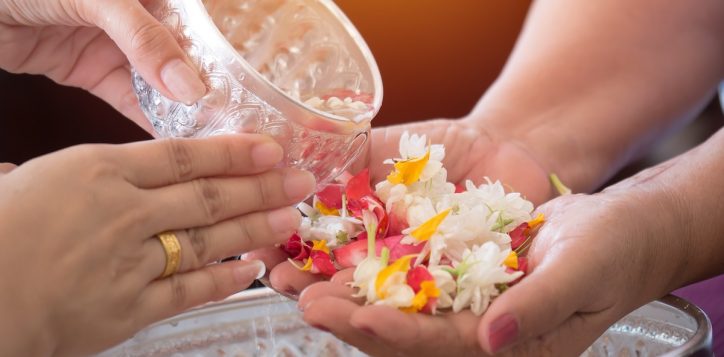 thai-people-celebrate-the-new-year-by-giving-flowers-and-watering-to-elderly-people-concept-gives-blessing-in-songkran-day-thailand