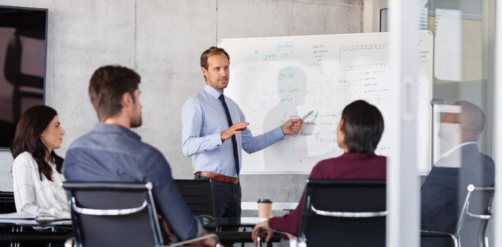 businessman-giving-presentation-with-colleagues