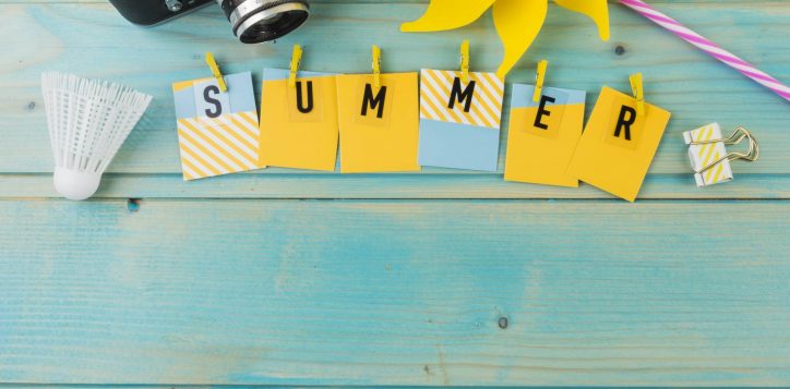 camera-shuttlecock-pinwheel-summer-with-clothespin-wooden-desk