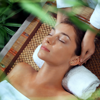 Woman enjoying head massage during Green Retreat spa treatment at A VIDA Spa, Mövenpick Myth Hotel Patong Phuket