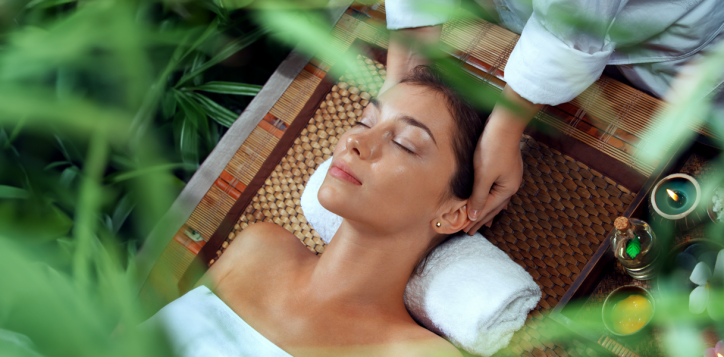 Woman enjoying head massage during Green Retreat spa treatment at A VIDA Spa, Mövenpick Myth Hotel Patong Phuket