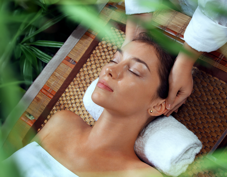 Woman enjoying head massage during Green Retreat spa treatment at A VIDA Spa, Mövenpick Myth Hotel Patong Phuket