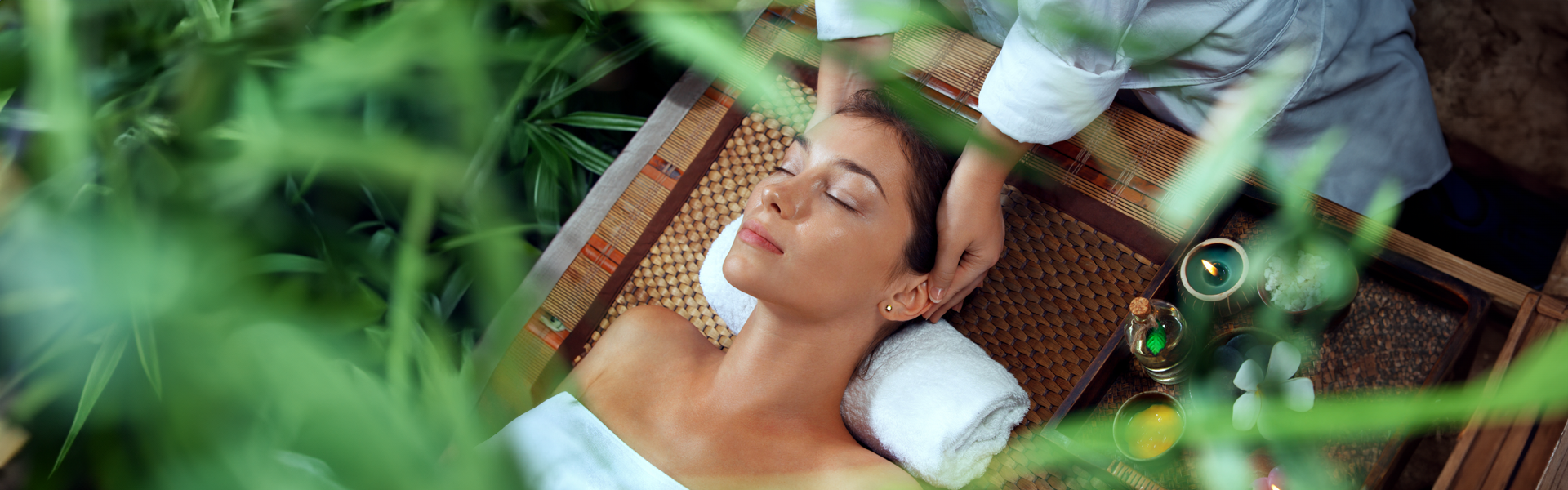Woman enjoying head massage during Green Retreat spa treatment at A VIDA Spa, Mövenpick Myth Hotel Patong Phuket