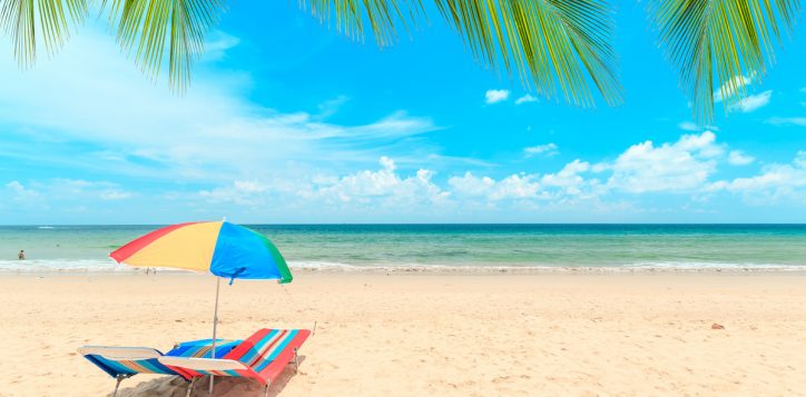 ka-ron-beach-at-phuket-thailand-white-sand-beach-with-beach-umbrella-summer-travel-vacation-and-holiday-concept