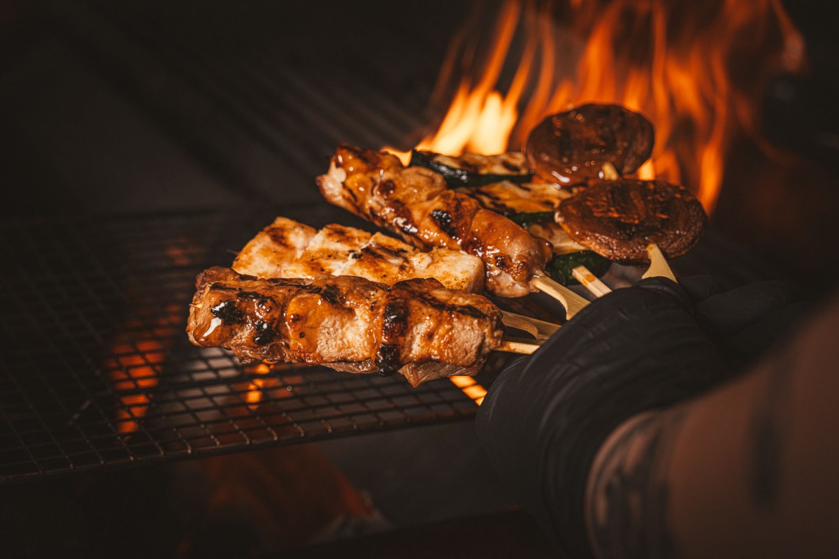 MOGA Sizzle Saturdays skewers on the grill with fire