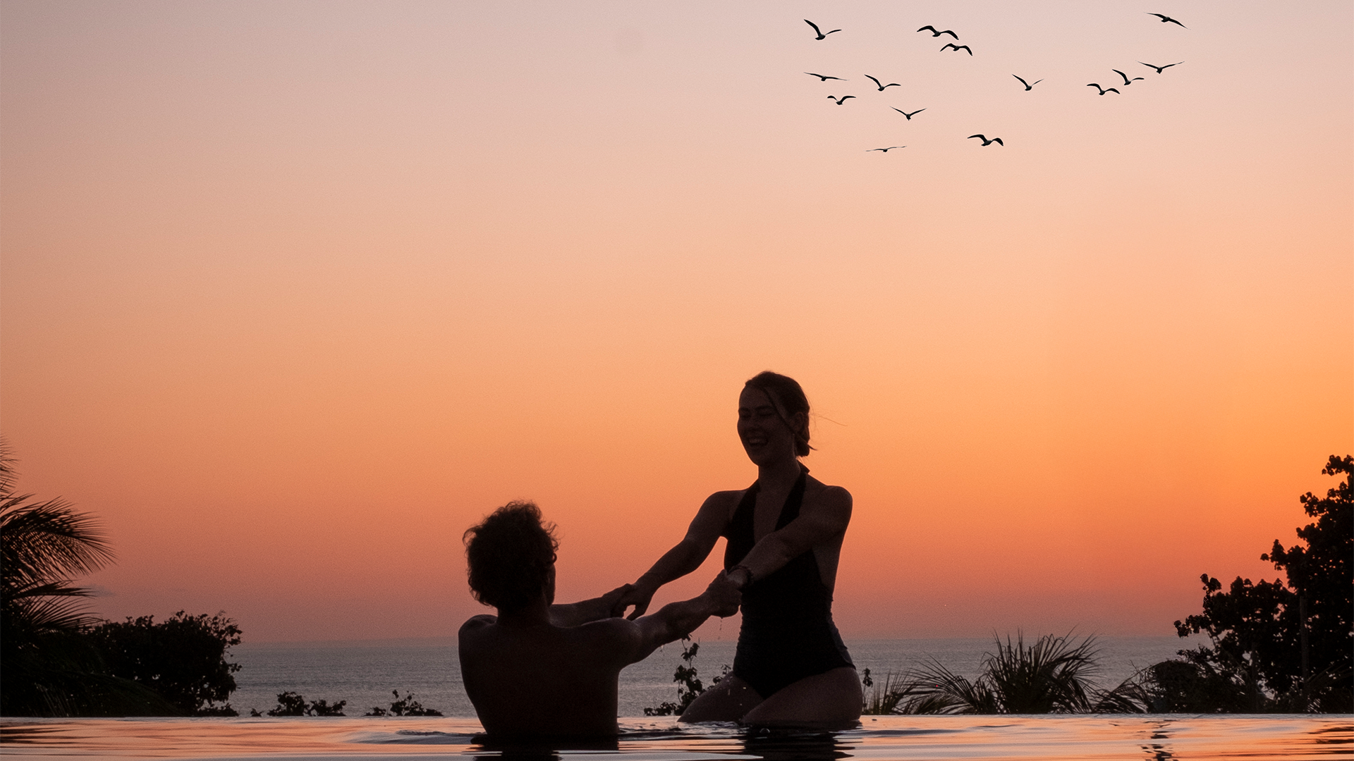 infinity pool, beachfornt resort, romantic escape, sunset