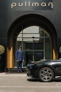 Main entrance of Pullman JLT, luxury hotel JLT near Dubai Marina, with concierge service and elegant exterior design.