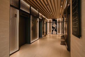 Elevator lobby at Pullman JLT, luxury hotel JLT near Dubai Marina, featuring modern lighting and contemporary design.