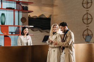 Guests checking in at Pullman JLT reception, a luxury hotel JLT near Dubai Marina with modern design and welcoming service