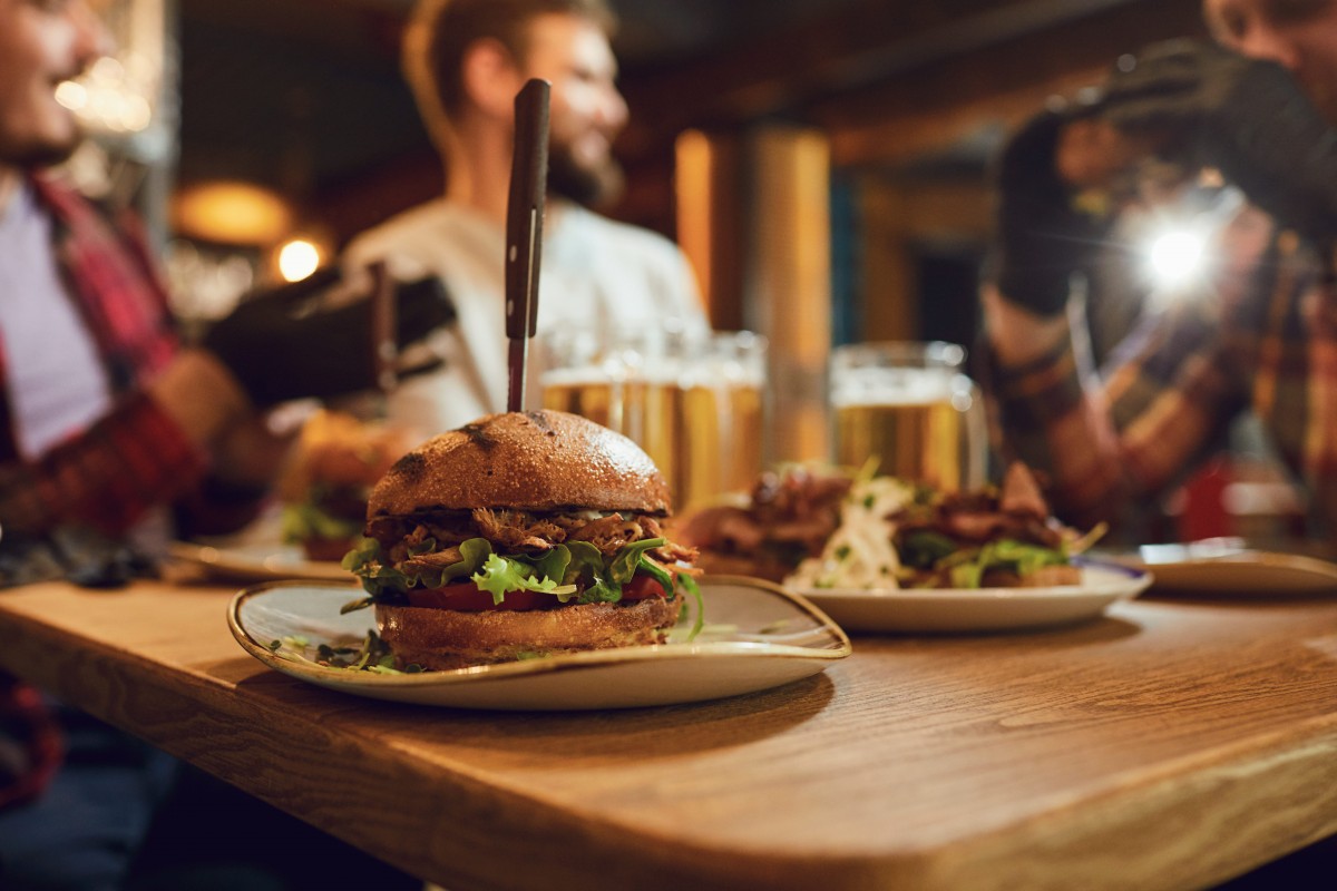 Burger and Pint JLT at La Vue featuring a juicy burger served with a Heineken pint for AED 109 every Thursday from 6 PM to midnight at Pullman Dubai Jumeirah Lakes Towers.