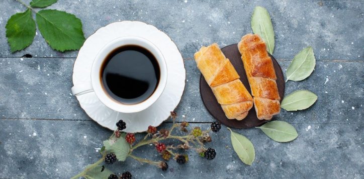 top-view-cup-coffee-along-with-sweet-delicious-bangles-berries-grey-wooden-sweet-bake-pastry-cake-sugar