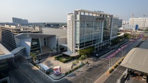 Novotel Bangkok IMPACT aerial drone view showing covered linkbridge connection to IMPACT Forum