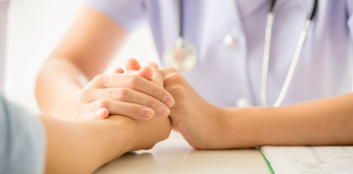 female-psychologist-consulting-patient-desk-hospital