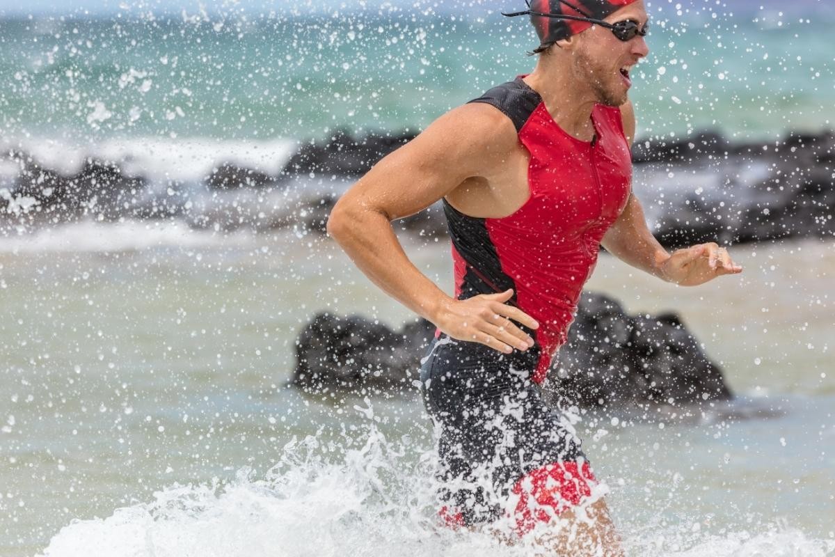 athlete running out of the water during IRONMAN 70.3 Da Nang