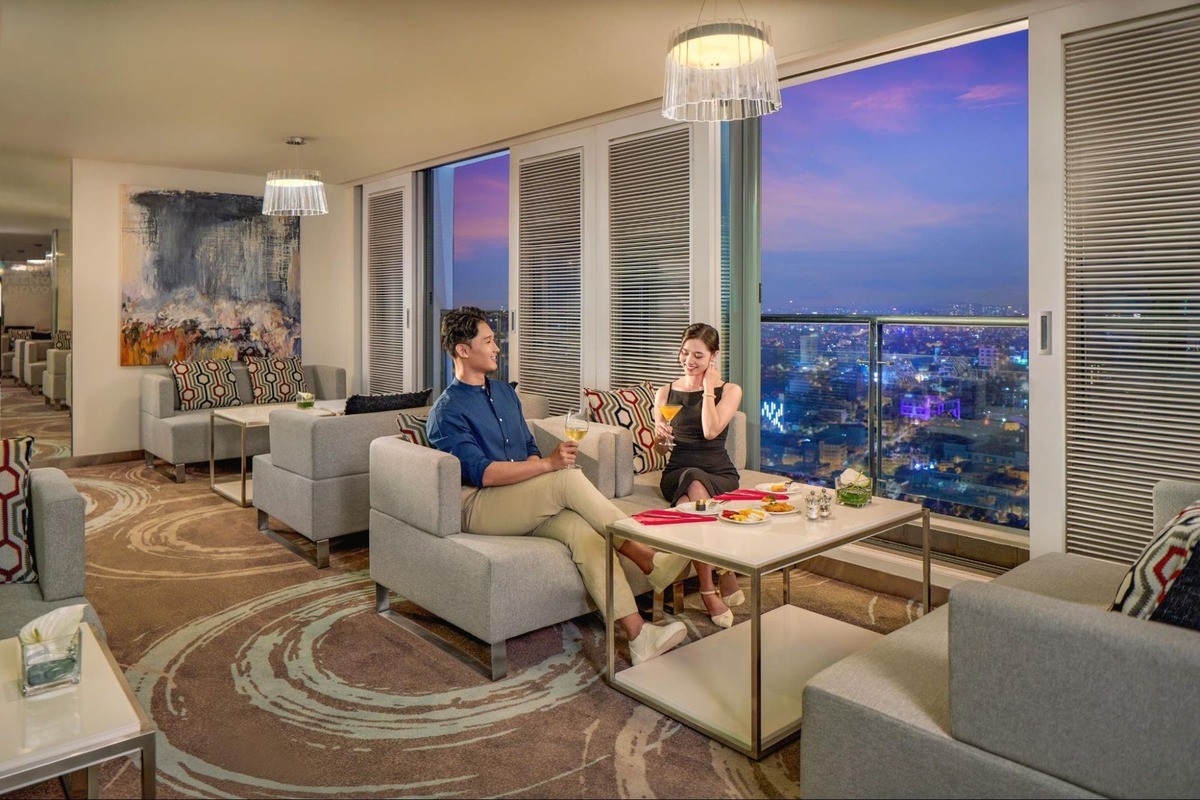 Executive Lounge with panoramic city night views at Novotel Saigon Centre