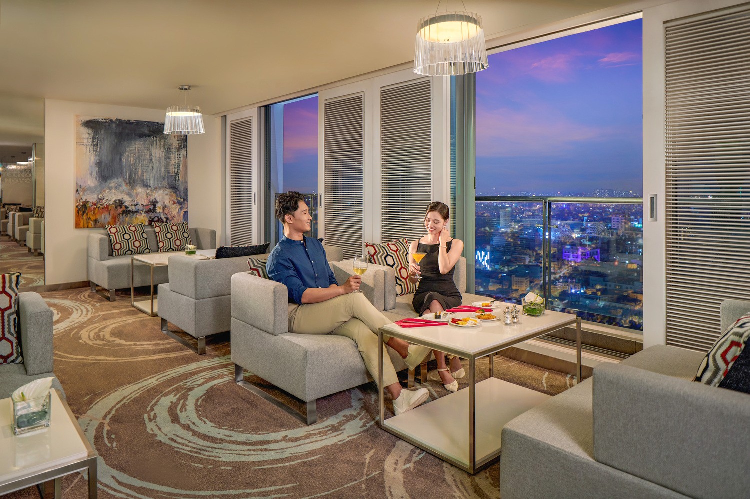 Executive Lounge with panoramic city night views at Novotel Saigon Centre