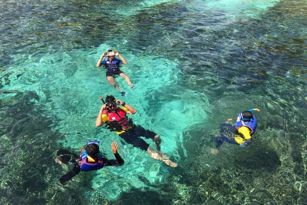 Snorkeling among coral reefs at Cham Islands near Hoi An