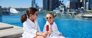 Children relaxing at outdoor infinity pool at Sofitel Sydney Darling Harbour
