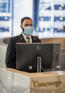 Concierge wearing face mask as part of ALLSAFE / Covid-safe procedure