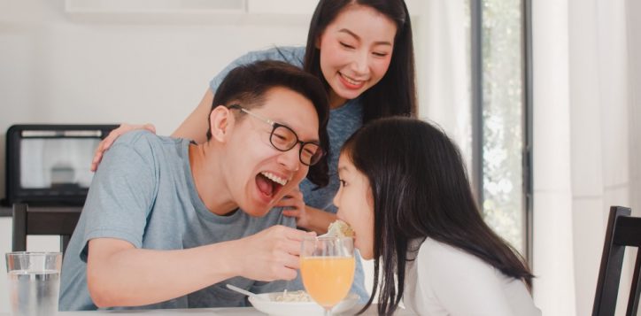 asian-japanese-family-has-breakfast-home-asian-happy-dad-mom-daughter-eat-spaghetti-drink-orange-juice-table-modern-kitchen-house-morning