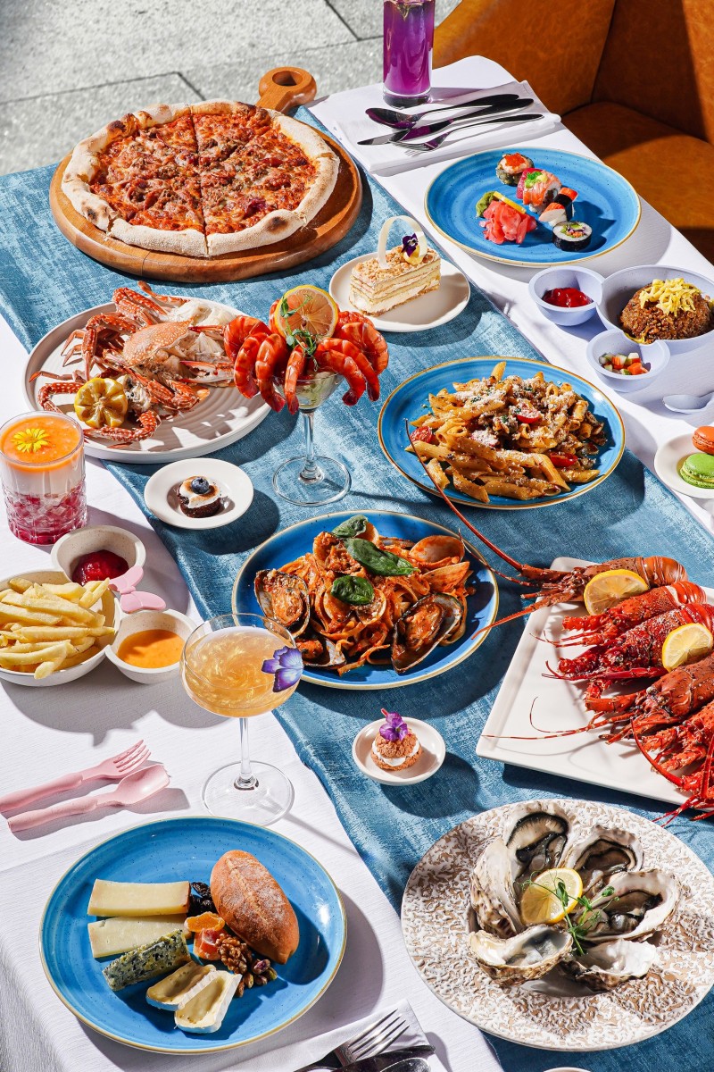 sunday brunch, seafood platting on the table, shrimp cocktail, lobsters, pizza