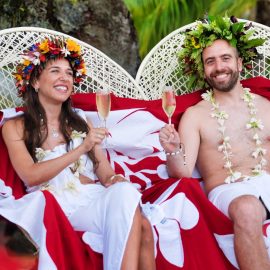 couple seated and smiling with champagne x jpeg