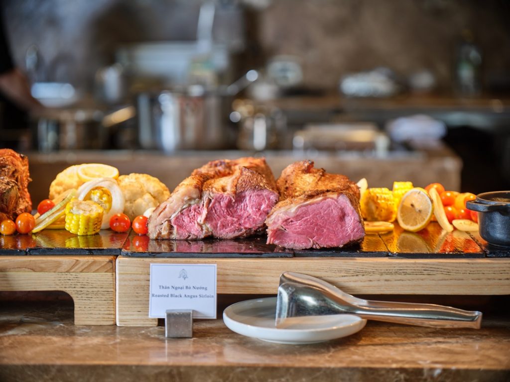 Chef carving roasted Black Angus sirloin at The Albion’s Sunday brunch.